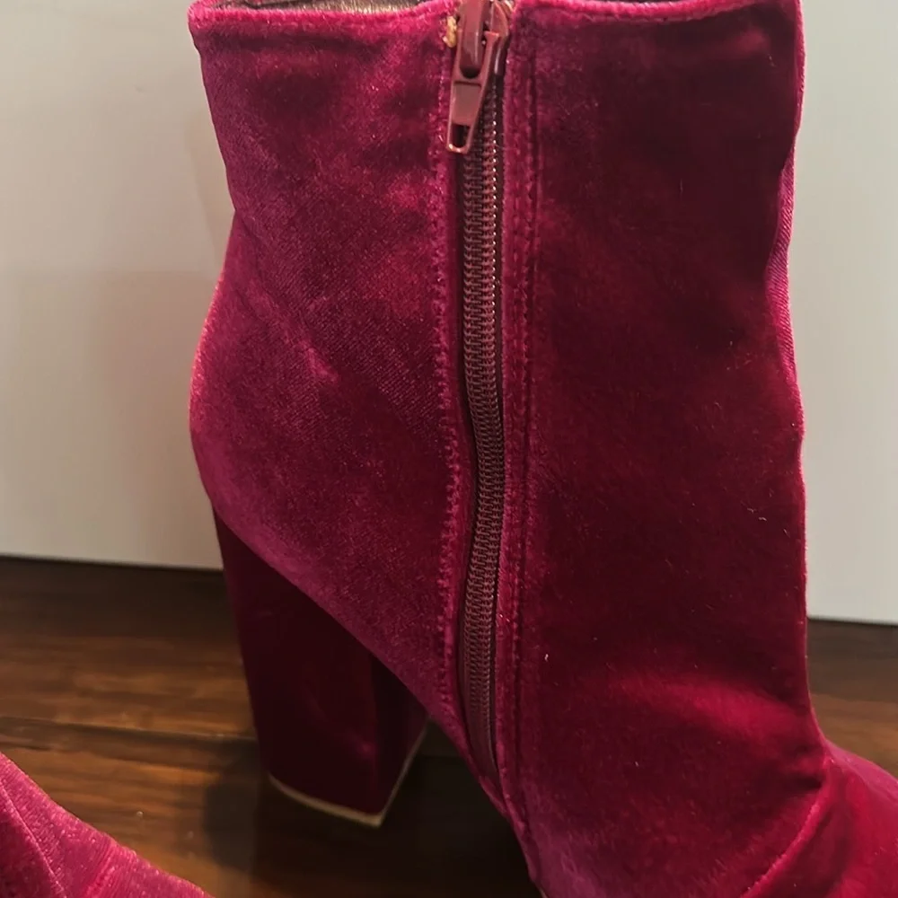 New but tried on Velvet Pink Ankle Boots. Size 9.5. Zip on side. Heel 4”.